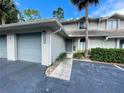 Townhome exterior featuring a two car garage at 122 Crown Point Cir, Longwood, FL 32779