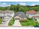 Aerial view of a house and its surrounding neighborhood at 273 Willow View Dr, Davenport, FL 33896