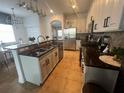 Modern kitchen with granite counters and island at 7416 Soiree Way, Reunion, FL 34747