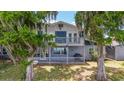 Two story house with a balcony and a deck at 1149 Shady Cove E Rd, Haines City, FL 33844