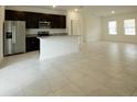Open kitchen with dark cabinets and granite countertops at 6952 Sw 152Nd St, Ocala, FL 34473