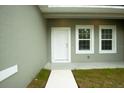 House exterior view of front door and side windows at 6952 Sw 152Nd St, Ocala, FL 34473