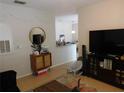 Living room with TV, furniture, and view to kitchen at 824 Grand Regency Pt # 102, Altamonte Springs, FL 32714