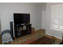 Living room featuring a large TV and ample space at 824 Grand Regency Pt # 102, Altamonte Springs, FL 32714