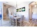 Bright dining room with light wood table and six chairs at 244 Capri Dr, Davenport, FL 33897