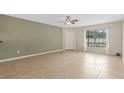 Spacious living room with tile floors and ceiling fan at 3651 N Goldenrod Rd # B107, Winter Park, FL 32792