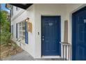 Private entrance with blue door and walkway at 3651 N Goldenrod Rd # B107, Winter Park, FL 32792