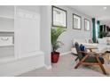 Modern entryway with built-in shelving and seating at 1870 Summer Dr, Davenport, FL 33897