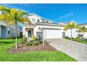 Beautiful two-story house with a large driveway and landscaping at 1870 Summer Dr, Davenport, FL 33897