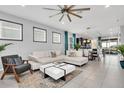 Open living space with a sectional sofa and stylish coffee table at 1870 Summer Dr, Davenport, FL 33897