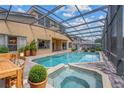 Relaxing pool and spa with covered patio; perfect for outdoor entertaining at 334 Chadwick Dr, Davenport, FL 33837