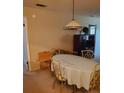 Dining area with oval table, chairs, and light-colored tablecloth at 6182 Willowpointe # B201, Orlando, FL 32822