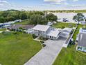 Lakefront property with large yard and driveway at 7220 Grace Rd, Orlando, FL 32819