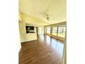 Bright living room with wood floors and kitchen bar at 1059 S Hiawassee Rd # 1824, Orlando, FL 32835