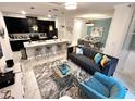 Open concept living space with kitchen, dining, and sitting areas at 962 Splash Shot Pl, Davenport, FL 33896
