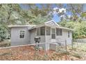 Front view of a renovated gray house with fenced yard and mailbox at 448 Nw 18Th Ave, Ocala, FL 34475