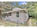 Side view of a renovated gray house with fenced yard at 448 Nw 18Th Ave, Ocala, FL 34475