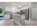 Modern kitchen with stainless steel appliances and island at 370 Routh Ave, New Smyrna Beach, FL 32168