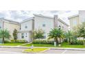 Modern two-story home with landscaped lawn and driveway at 4562 Narrative Ln, Kissimmee, FL 34746