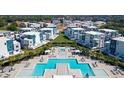 Luxury community pool and surrounding villas at 7740 Sandy Ridge Dr # 234, Reunion, FL 34747