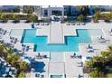 Resort-style pool with spacious deck and lounge chairs at 7740 Sandy Ridge Dr # 234, Reunion, FL 34747