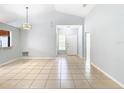 Bright living room with tile floors and vaulted ceilings at 428 Short Pine Cir, Orlando, FL 32807