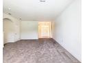 Bright living room with neutral walls and carpeting at 2543 Old Kent Cir, Kissimmee, FL 34758