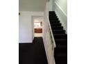 Staircase leading to upper level and kitchen view at 2222 Silver Pines Pl # 902, Orlando, FL 32808