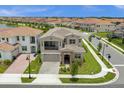 Stunning aerial view of a two-story house in a residential neighborhood at 13839 Larkton Ln, Orlando, FL 32832