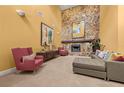 Spacious living room with a stone fireplace, sectional sofa, and high ceilings at 9525 Mcnorton Rd, Altamonte Springs, FL 32714