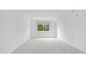 Bright and airy bedroom with neutral carpeting and a window at 1150 Carmel Cir # 408, Casselberry, FL 32707