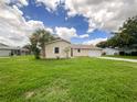 Ranch home with a large yard and attached garage at 3235 Cross Fox Dr, Mulberry, FL 33860