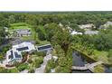 Aerial view showing home, pool, dock, and pond; large lot size at 2804 Dike Rd, Winter Park, FL 32792