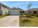 Two car garage and front yard at 6931 Wilson Pasture Ave, Groveland, FL 34736