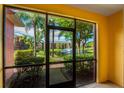 Screened porch overlooking a pond and lush landscaping at 3502 Windy Walk Way # 2104, Orlando, FL 32837