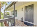 Inviting home exterior featuring a covered porch and stylish front door at 1232 Bel Aire Dr, Daytona Beach, FL 32118