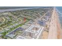 Aerial view of property near beach and oceanfront at 1232 Bel Aire Dr, Daytona Beach, FL 32118