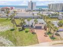 Beachfront property with palm trees and ocean view at 1232 Bel Aire Dr, Daytona Beach, FL 32118