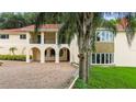 House exterior with brick driveway and lush landscaping at 201 Tranquility Cv, Altamonte Springs, FL 32701