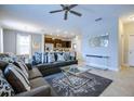 Spacious living room with gray sectional sofa and coffee table at 5299 Wildwood Way, Davenport, FL 33837