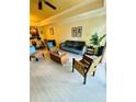 Living room with light flooring and comfy seating at 7652 Whisper Way # 302, Reunion, FL 34747