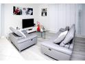 Living room with gray couches and a glass coffee table at 435 Caribbean Dr, Davenport, FL 33897