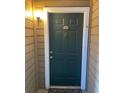 Condo building entryway with green door and number 109 at 4301 Lizshire Ln # C-109, Orlando, FL 32822