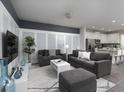 Spacious living room with comfortable seating and a modern aesthetic at 1505 Carey Palm Cir, Kissimmee, FL 34747