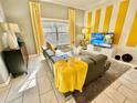 Bright living room with modern furniture and decor at 4805 Clock Tower Dr, Kissimmee, FL 34746