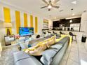 Open living room and kitchen with modern design at 4805 Clock Tower Dr, Kissimmee, FL 34746