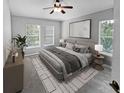Main bedroom with carpeted floor, large windows, and ceiling fan at 10888 Eclipse Lily Way # 62A, Orlando, FL 32832