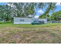 Mobile home with deck and storage shed in the backyard at 1825 Ruby St, Lakeland, FL 33815