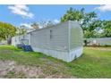 Side view of the mobile home showcasing its exterior features at 1825 Ruby St, Lakeland, FL 33815