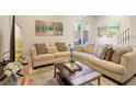 Spacious living room with two sofas and a coffee table at 7571 Sunny Dreams Ln, Kissimmee, FL 34747